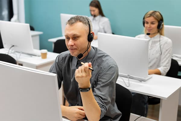 colleagues working together in a call center office